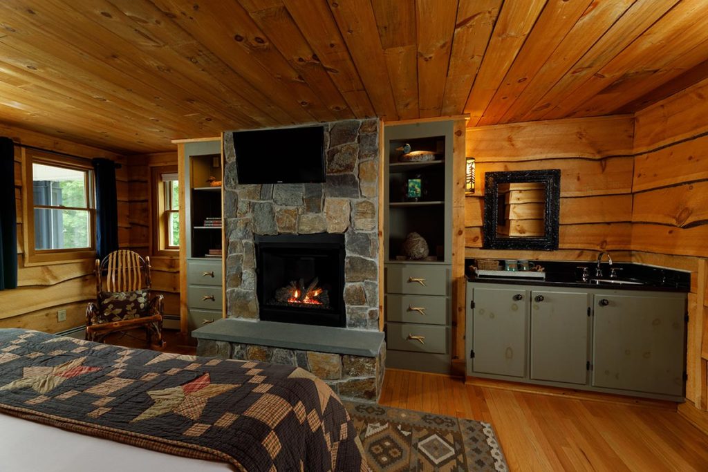 Snowmobile in Upstate New York, cozy guest room with a fire