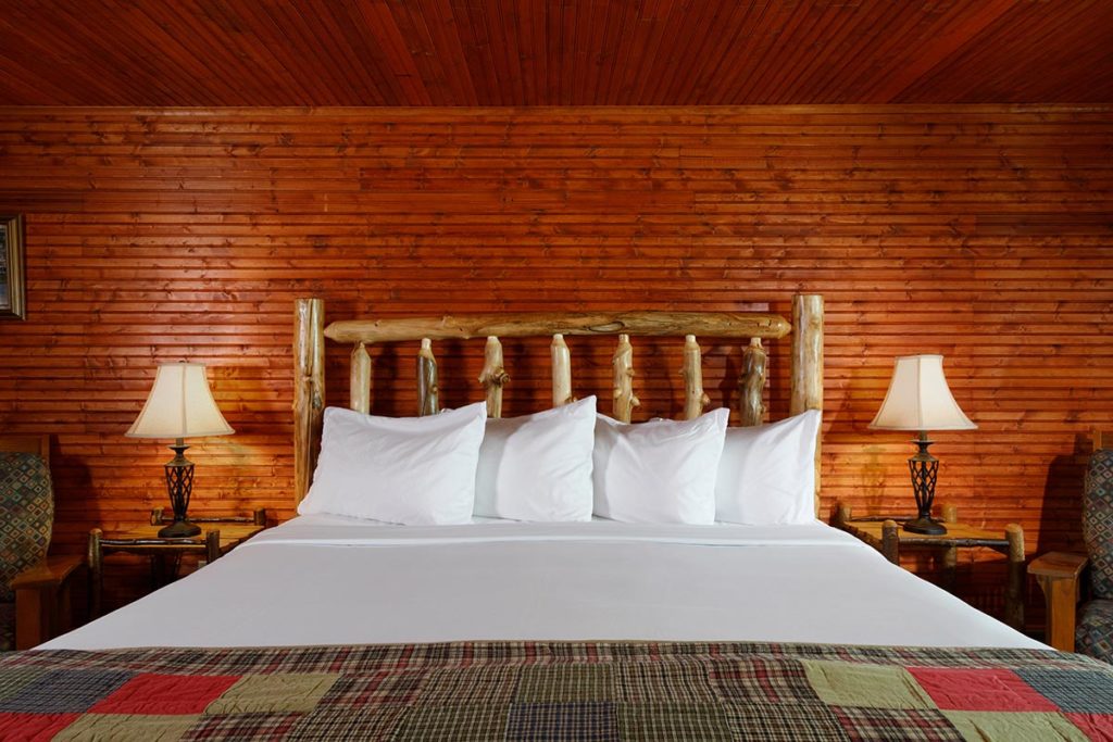 Lake George Winter Activities, photo of a cozy bed in our Upstate New York Hotel