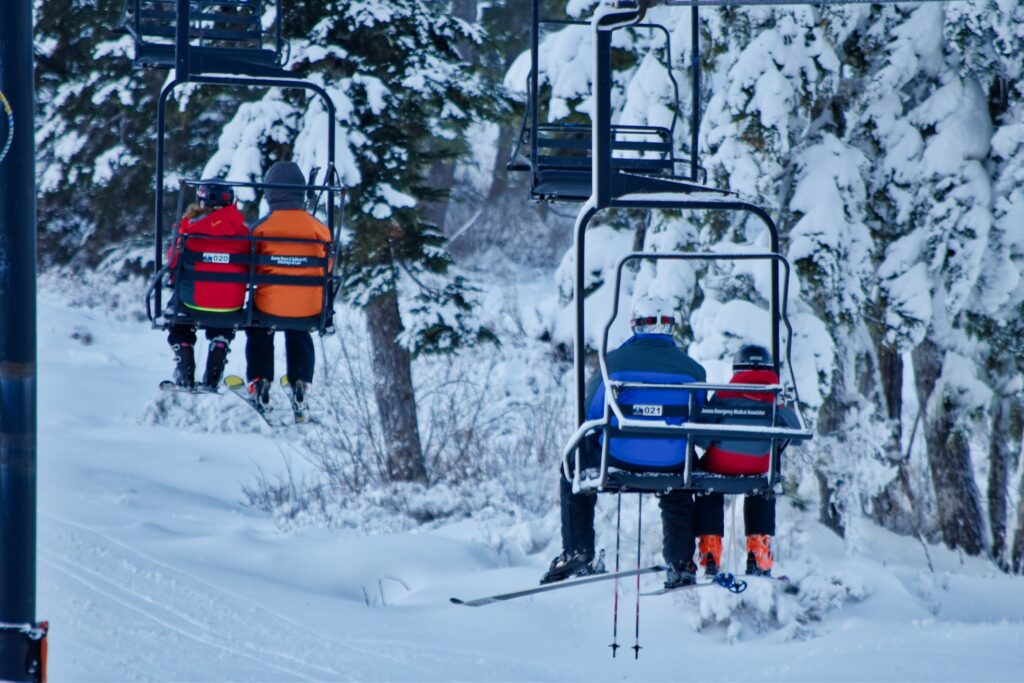 A day of fun Gore Mountain ski resort, people riding on the lifts up the mountain