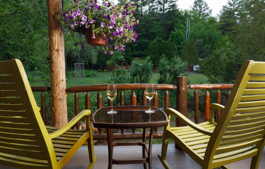 A summer afternoon on the porch, enjoying wine at our hotel, rated as one of the best romantic getaways in New York State