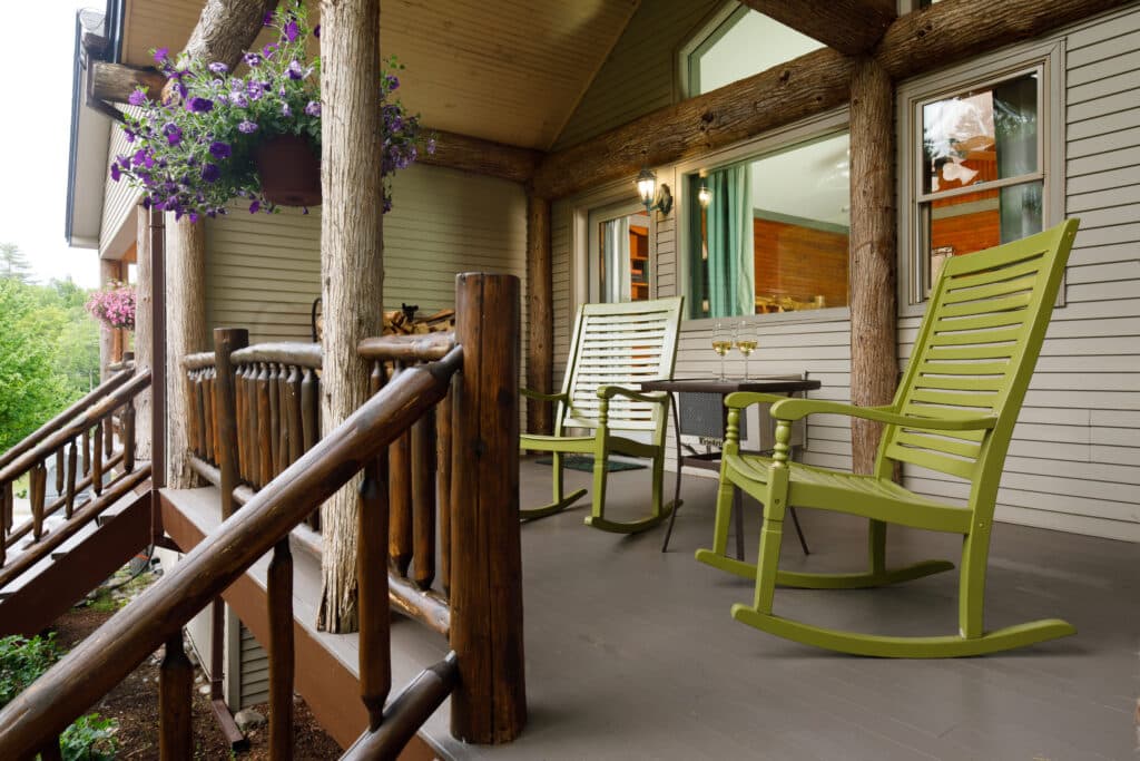 Enjoy a glass of wine on your porch at the best lodging near Gore Mountain Ski Resort.