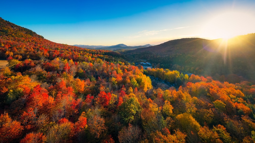 Hiking in the Adirondacks, stunning aerial shot of the mountains awash in fall color