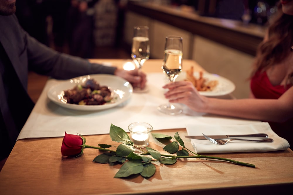 Romantic Adirondacks Getaways, happy couple dining at our on-site restaurant at our Adirondack hotel